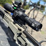 fundamentalsLevel2SomeFreeWisdomGallery2 A close up of a rifle with large optics installed.