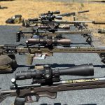 fundamentalsLevel2SomeFreeWisdomGallery5 A row of rifles on a shooting platform.